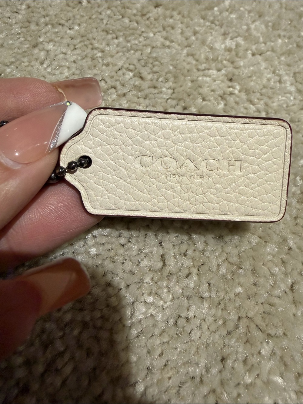 Coach Cream Leather Tag with Subtle Embossed Logo